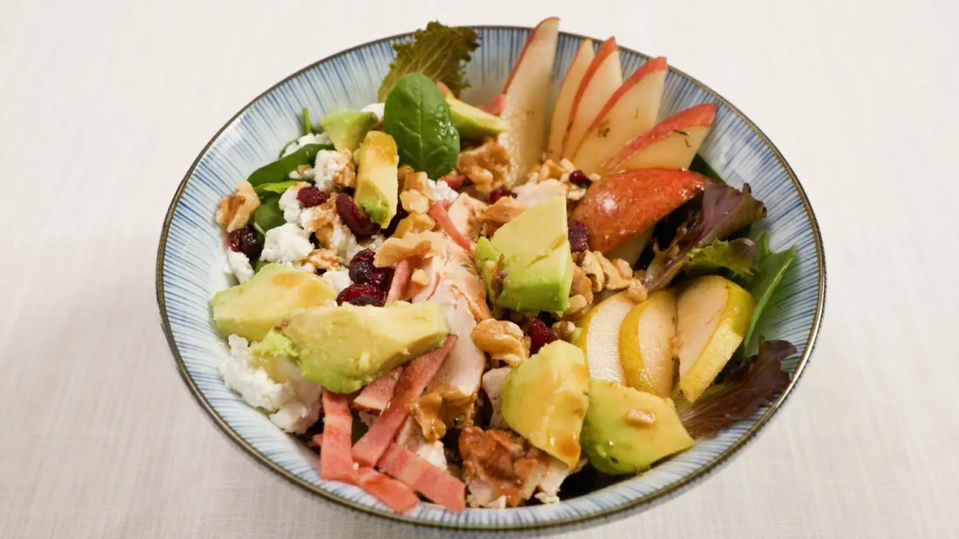Pear salad with walnuts, avocado, and grilled chicken