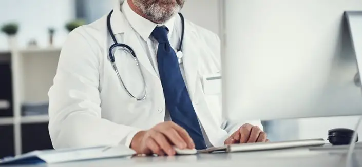 a doctor using a computer