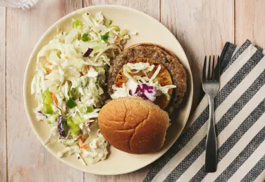 Jerk spiced chicken burger with carrot and cabbage coleslaw