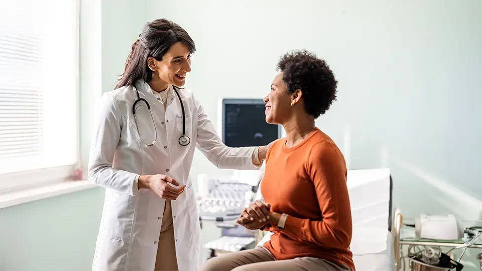 Medical-practitioner-reassuring-a-patient-960x540