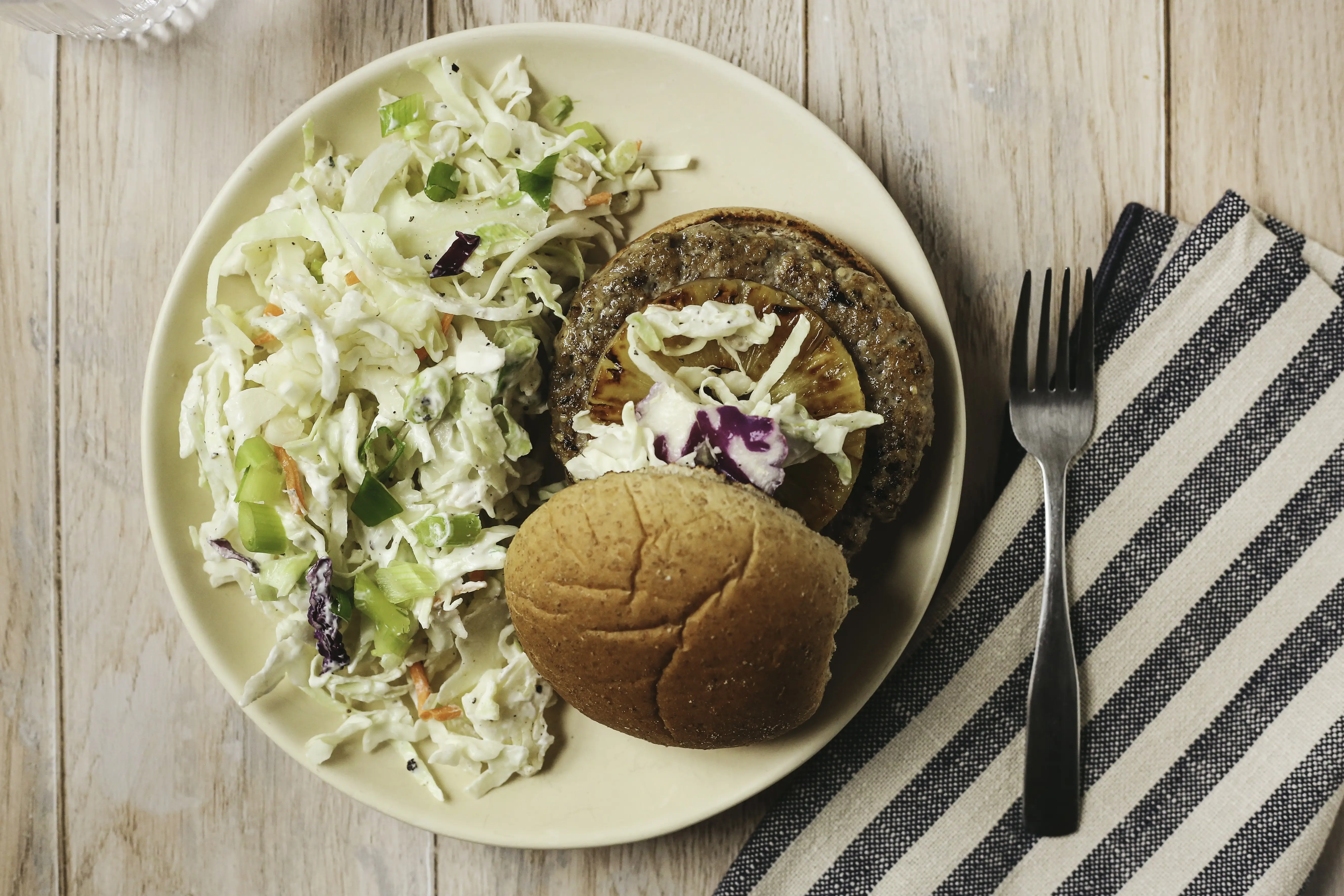 Jerk spiced chicken burger with carrot and cabbage coleslaw