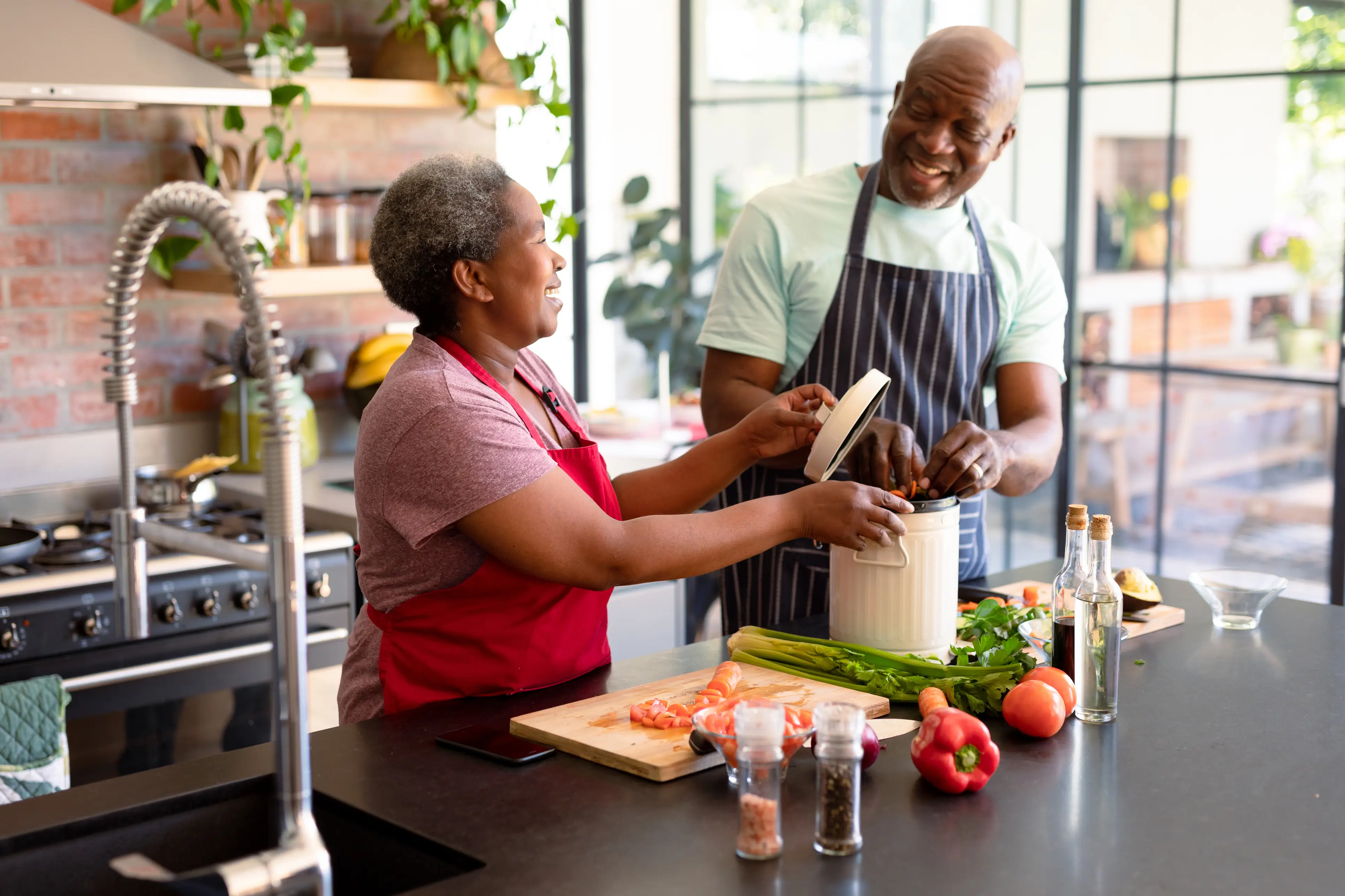 a man and woman in a kitchen